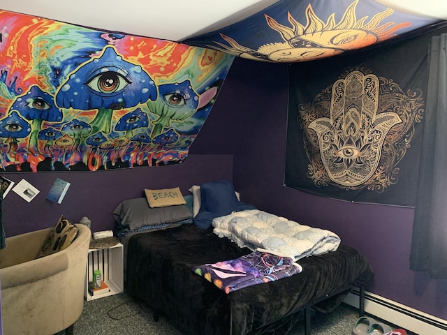 bedroom with carpet floors and baseboard heating