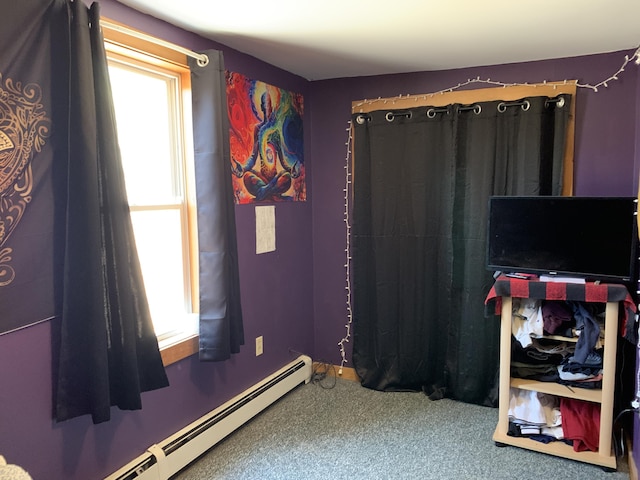 interior space featuring a baseboard radiator and carpet floors