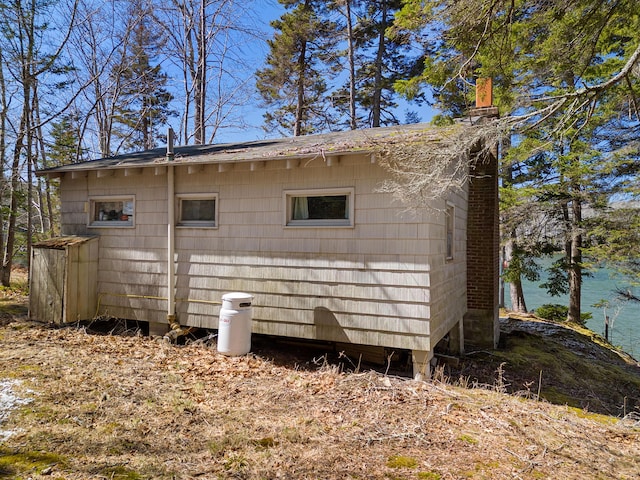 57 Samoset Trl, Boothbay, ME 04544 - view of side of property featuring a chimney and a water view