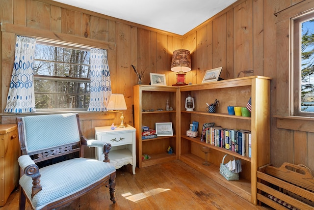 57 Samoset Trl, Boothbay, ME 04544 - sitting room with wood-type flooring and wooden walls