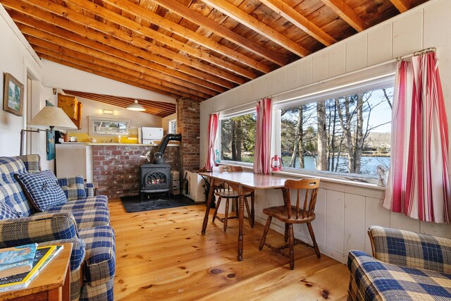 57 Samoset Trl, Boothbay, ME 04544 - interior space with a water view, vaulted ceiling with beams, wood finished floors, wood ceiling, and a wood stove