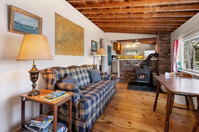 57 Samoset Trl, Boothbay, ME 04544 - living room featuring wooden ceiling, a wood stove, light wood-style floors, and beamed ceiling