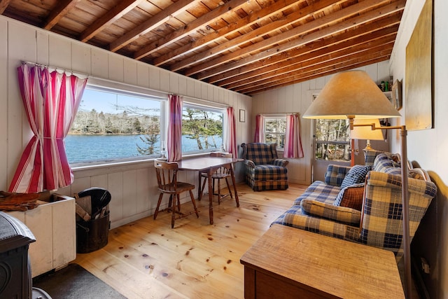 57 Samoset Trl, Boothbay, ME 04544 - living area featuring hardwood / wood-style flooring, lofted ceiling with beams, a water view, wood ceiling, and wood walls