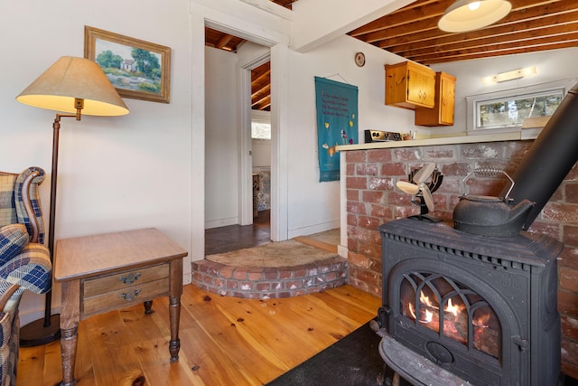 57 Samoset Trl, Boothbay, ME 04544 - living area featuring a wood stove, hardwood / wood-style floors, and plenty of natural light