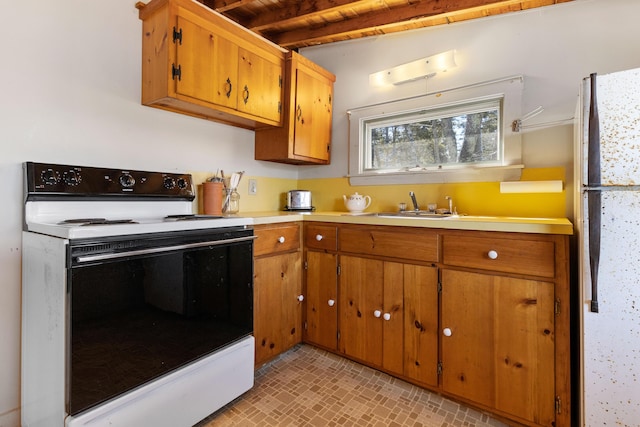 57 Samoset Trl, Boothbay, ME 04544 - kitchen featuring light countertops, electric range oven, freestanding refrigerator, and a sink