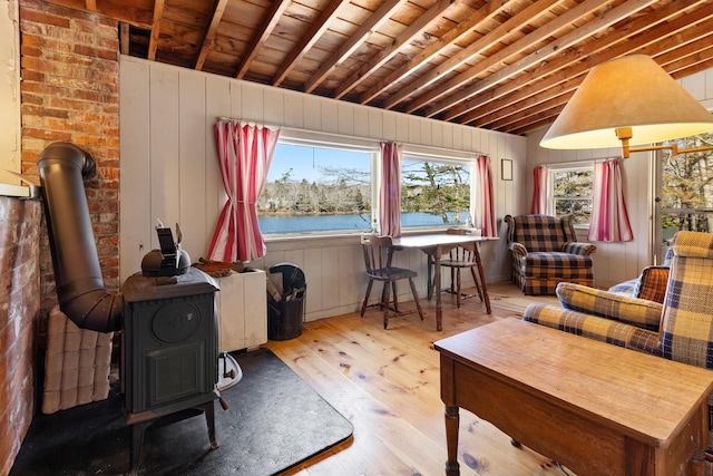 57 Samoset Trl, Boothbay, ME 04544 - sitting room with wooden walls, wood ceiling, a wood stove, wood-type flooring, and lofted ceiling