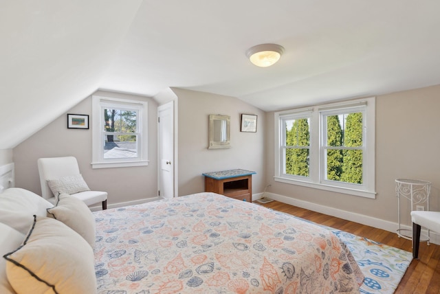 72 US Route 1, Falmouth, ME 04105 - bedroom with wood finished floors, lofted ceiling, and baseboards