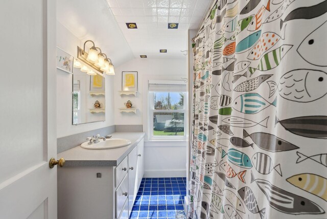 72 US Route 1, Falmouth, ME 04105 - full bathroom featuring tile patterned flooring, vanity, lofted ceiling, and curtained shower