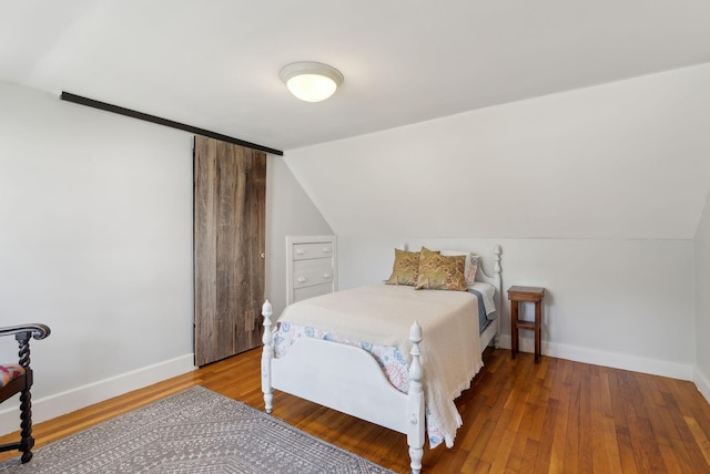72 US Route 1, Falmouth, ME 04105 - bedroom featuring lofted ceiling, baseboards, and wood-type flooring