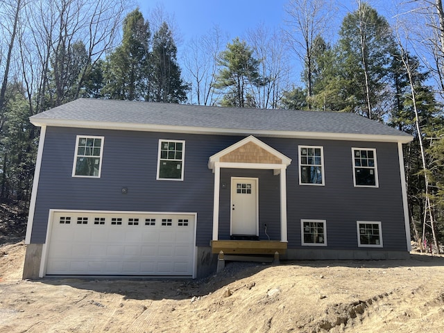 169 Deer Crossing Rd, Limerick, ME 04048 - split foyer home with dirt driveway and roof with shingles