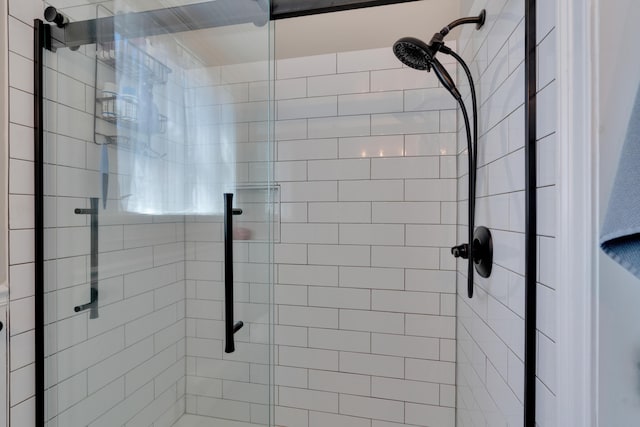 full bath with a shower stall