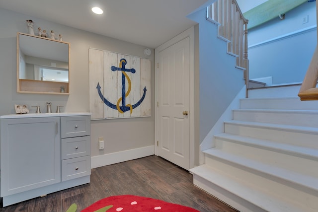 interior space with wood finished floors, baseboards, and recessed lighting