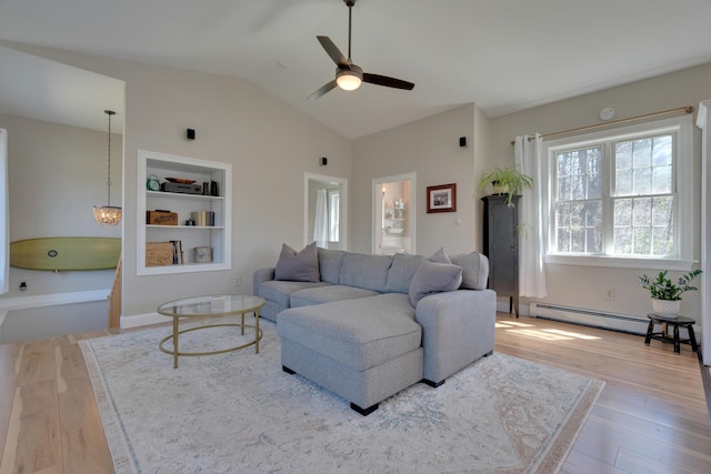 living area with a baseboard radiator, vaulted ceiling, a ceiling fan, and wood finished floors