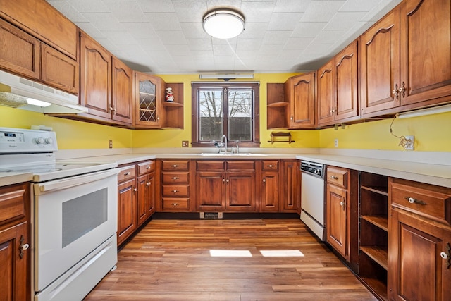 kitchen featuring a sink, open shelves, white appliances, and under cabinet range hood