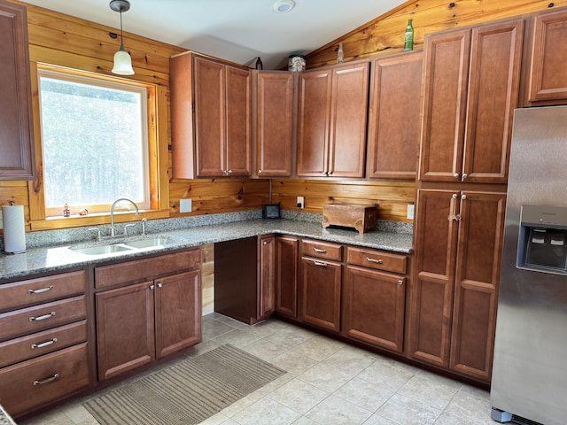 441 Works Rd, Jackson, ME 04921 - kitchen featuring lofted ceiling, stone countertops, a sink, wooden walls, and stainless steel refrigerator with ice dispenser