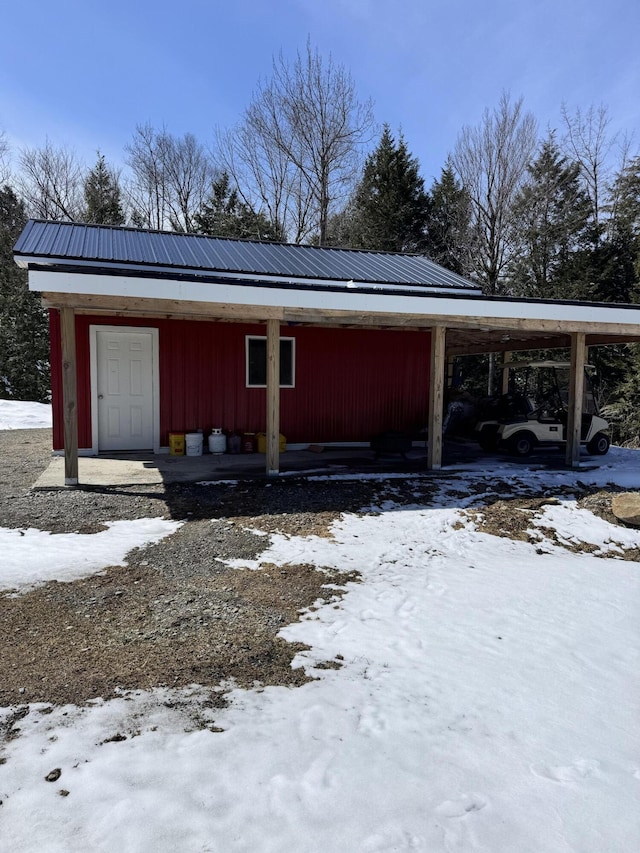 441 Works Rd, Jackson, ME 04921 - view of snow covered exterior featuring metal roof and a carport