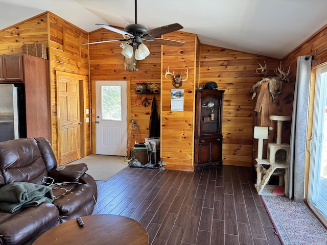 441 Works Rd, Jackson, ME 04921 - living area with a ceiling fan, wooden walls, dark wood-style flooring, and lofted ceiling