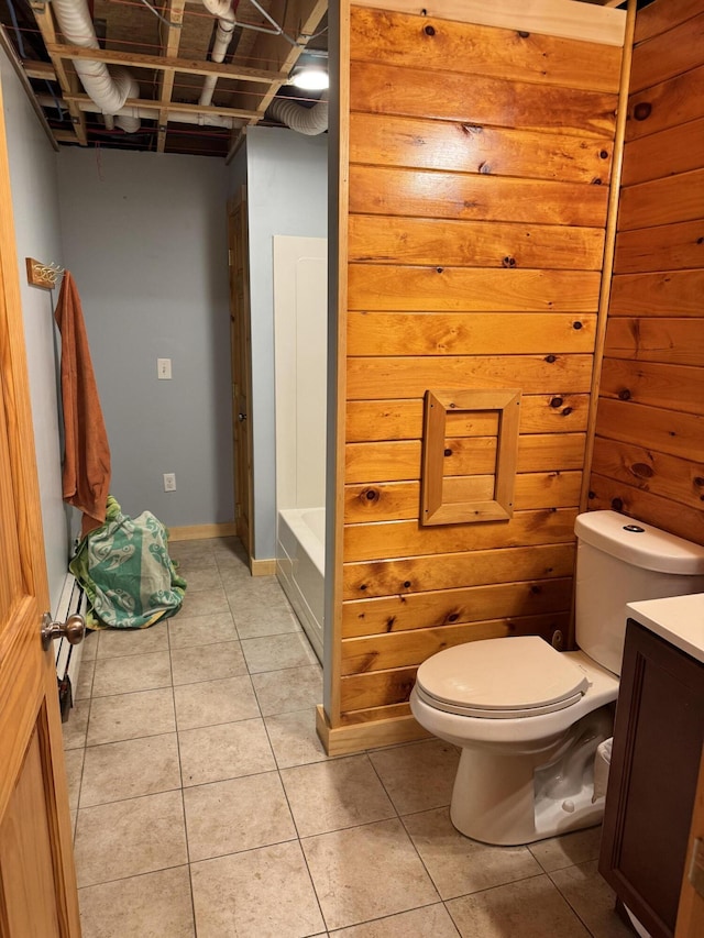 441 Works Rd, Jackson, ME 04921 - full bathroom featuring toilet, vanity, tile patterned flooring, a washtub, and baseboards