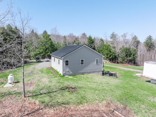 441 Works Rd, Jackson, ME 04921 - view of home's exterior with a yard and metal roof
