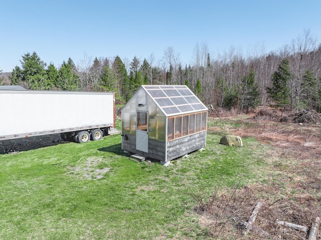 441 Works Rd, Jackson, ME 04921 - view of yard with a wooded view, an outdoor structure, and an exterior structure