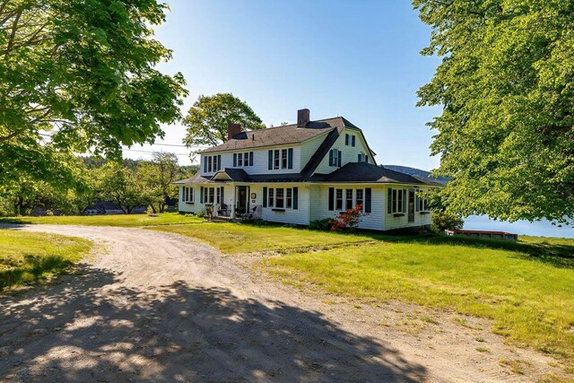 480 Sound Dr, Mount Desert, ME 04660 - view of front facade featuring a gambrel roof, a chimney, driveway, and a front lawn