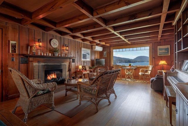480 Sound Dr, Mount Desert, ME 04660 - living area with a brick fireplace, hardwood / wood-style flooring, wooden walls, beamed ceiling, and coffered ceiling