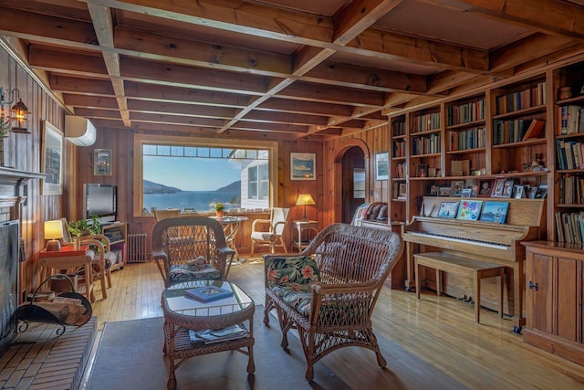 480 Sound Dr, Mount Desert, ME 04660 - sitting room with arched walkways, wooden walls, plenty of natural light, and coffered ceiling