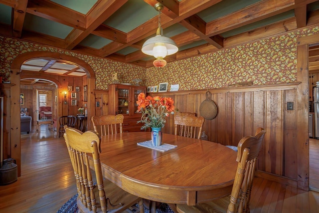 480 Sound Dr, Mount Desert, ME 04660 - dining space featuring coffered ceiling, arched walkways, hardwood / wood-style floors, and wallpapered walls