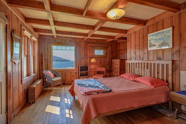480 Sound Dr, Mount Desert, ME 04660 - bedroom featuring radiator, wooden walls, and hardwood / wood-style flooring