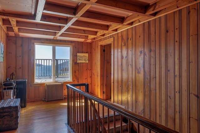 480 Sound Dr, Mount Desert, ME 04660 - corridor featuring an upstairs landing, wooden walls, radiator, coffered ceiling, and wood-type flooring