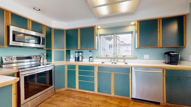 19 Spruce Head Rd, South Thomaston, ME 04858 - kitchen with appliances with stainless steel finishes, a sink, light countertops, and light wood-style flooring