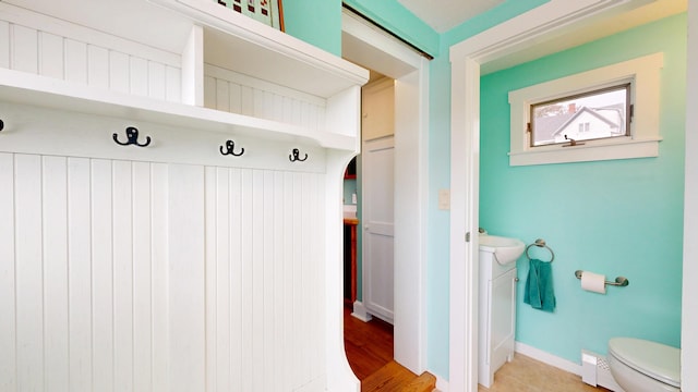 19 Spruce Head Rd, South Thomaston, ME 04858 - mudroom with baseboards, arched walkways, and baseboard heating
