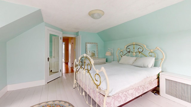 19 Spruce Head Rd, South Thomaston, ME 04858 - bedroom with hardwood / wood-style flooring and lofted ceiling
