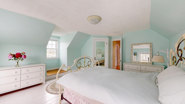 19 Spruce Head Rd, South Thomaston, ME 04858 - bedroom with lofted ceiling and wood finished floors