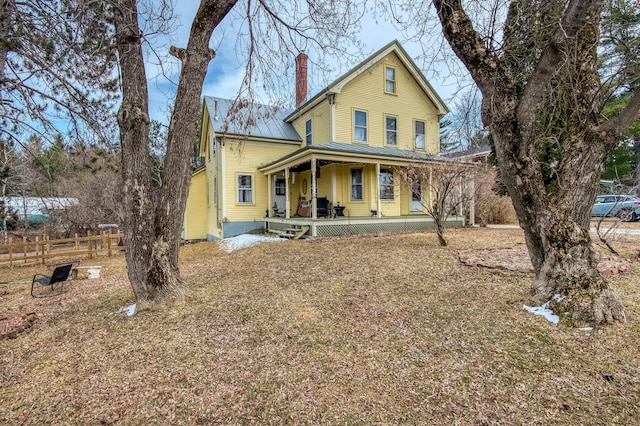 27 Pine St, Eustis, ME 04936 - view of front of property with a chimney, covered porch, a standing seam roof, and metal roof