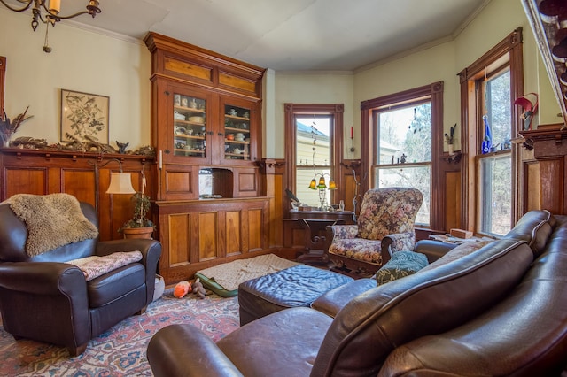 27 Pine St, Eustis, ME 04936 - living area with ornamental molding, wainscoting, and a decorative wall
