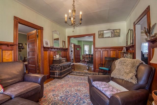 27 Pine St, Eustis, ME 04936 - living area with a chandelier, crown molding, a wainscoted wall, wood finished floors, and wood walls