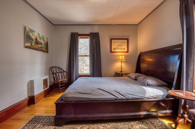 27 Pine St, Eustis, ME 04936 - bedroom with wood-type flooring, crown molding, and baseboards