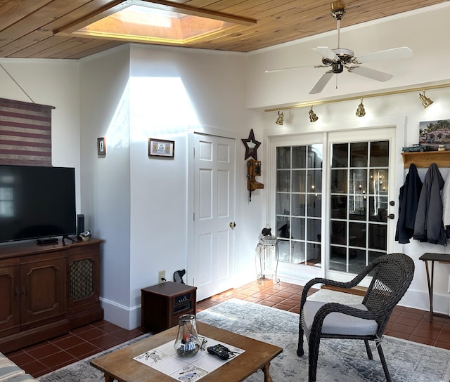 living area with lofted ceiling, tile patterned flooring, wooden ceiling, and ceiling fan