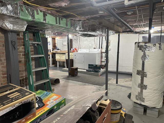 unfinished basement with washer and clothes dryer