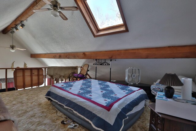 carpeted bedroom featuring a textured ceiling and lofted ceiling with beams