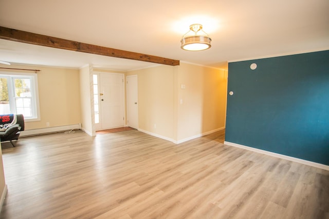 interior space with baseboard heating, baseboards, crown molding, and light wood-style flooring