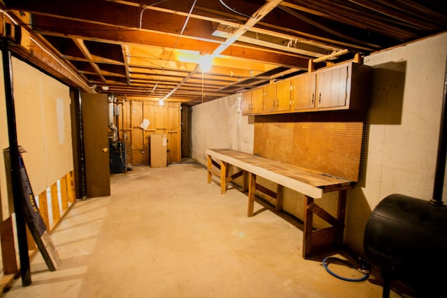 unfinished below grade area with a heating unit