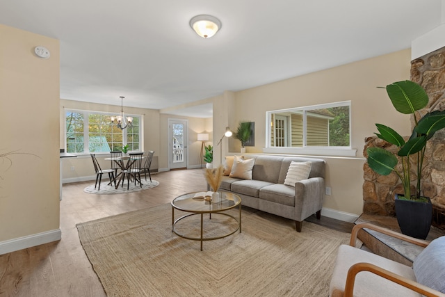 4 Peaceful Way, Windham, ME 04062 - living room featuring baseboards, a chandelier, and wood finished floors