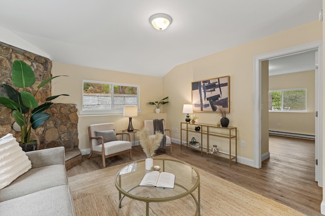 4 Peaceful Way, Windham, ME 04062 - living area with a baseboard radiator, wood finished floors, baseboards, and vaulted ceiling