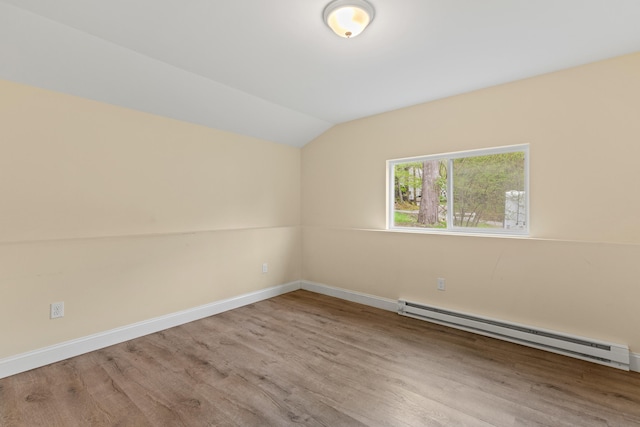 4 Peaceful Way, Windham, ME 04062 - unfurnished room featuring a baseboard heating unit, wood finished floors, vaulted ceiling, and baseboards
