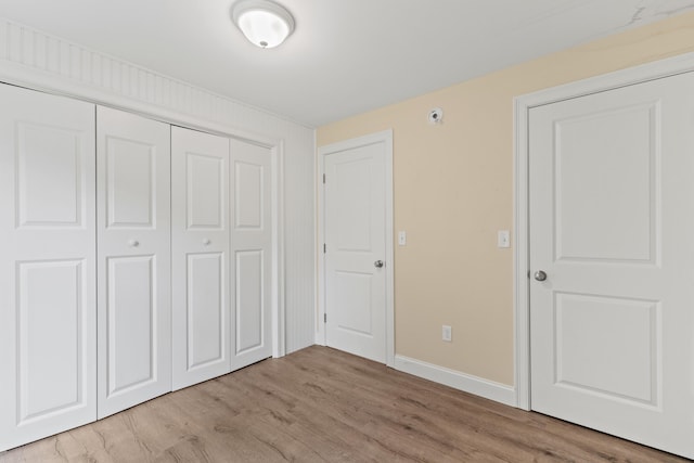 4 Peaceful Way, Windham, ME 04062 - unfurnished bedroom featuring light wood finished floors, a closet, and baseboards