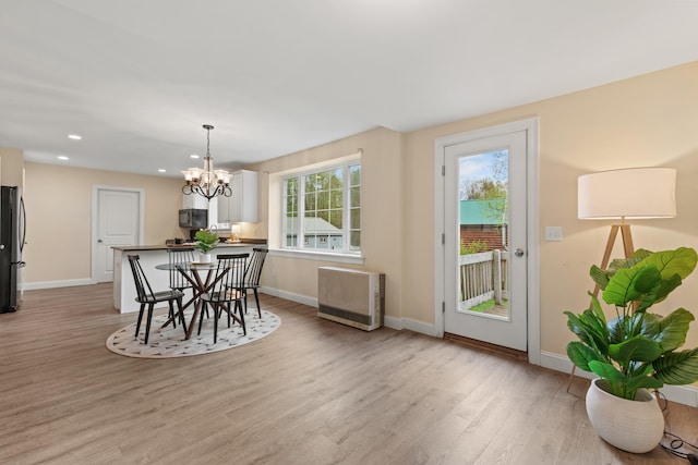 4 Peaceful Way, Windham, ME 04062 - dining space with heating unit, light wood-type flooring, baseboards, a chandelier, and recessed lighting
