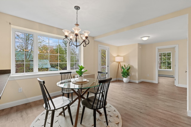 4 Peaceful Way, Windham, ME 04062 - dining room with baseboards, baseboard heating, wood finished floors, and a chandelier