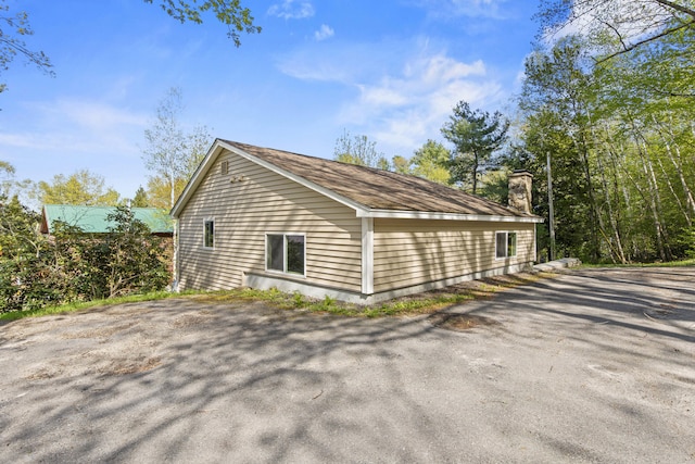4 Peaceful Way, Windham, ME 04062 - view of property exterior featuring a chimney